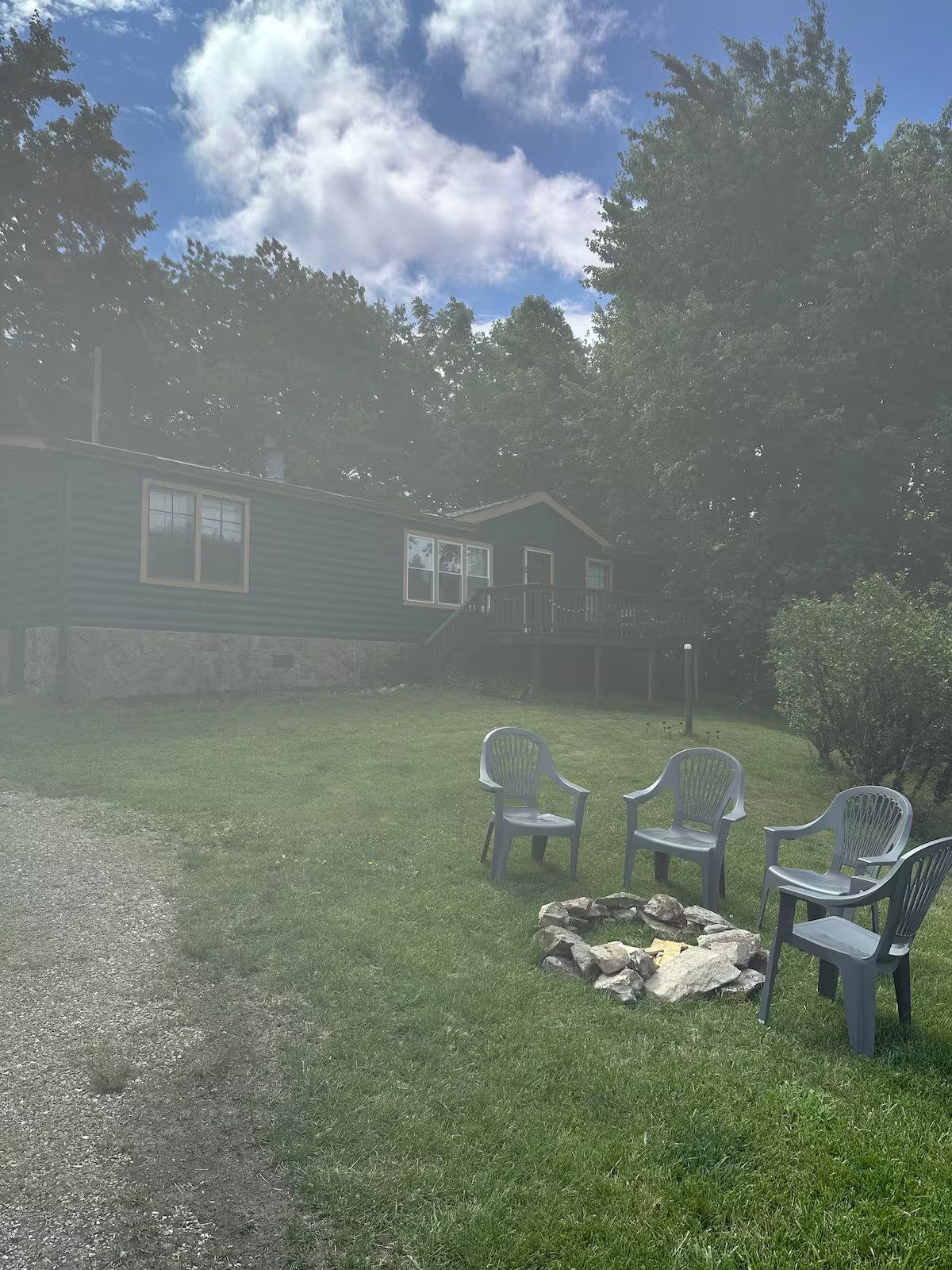 Ground-level fire pit seating area in the yard
