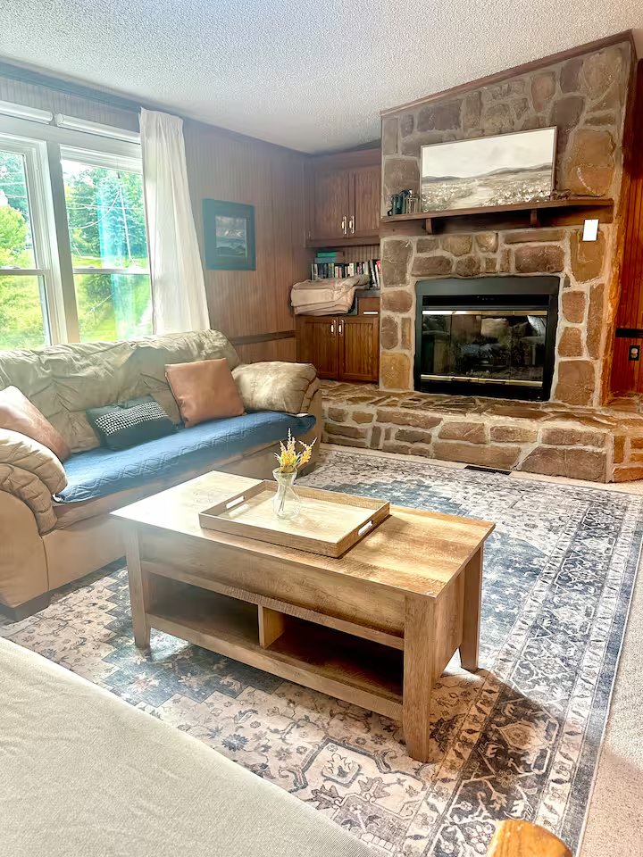 Living room with stone fireplace