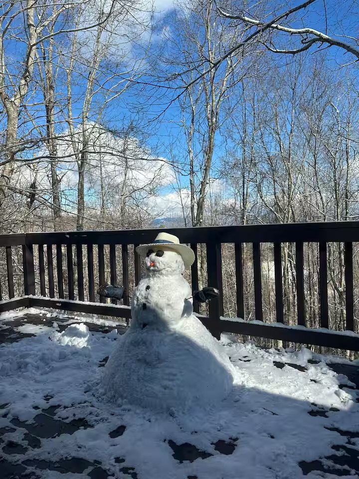 Snow-covered deck furniture in winter