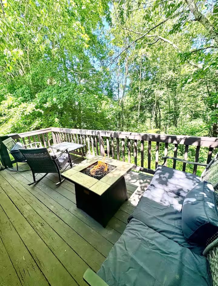 Mountain Retreat patio with gas firepit beneath the trees