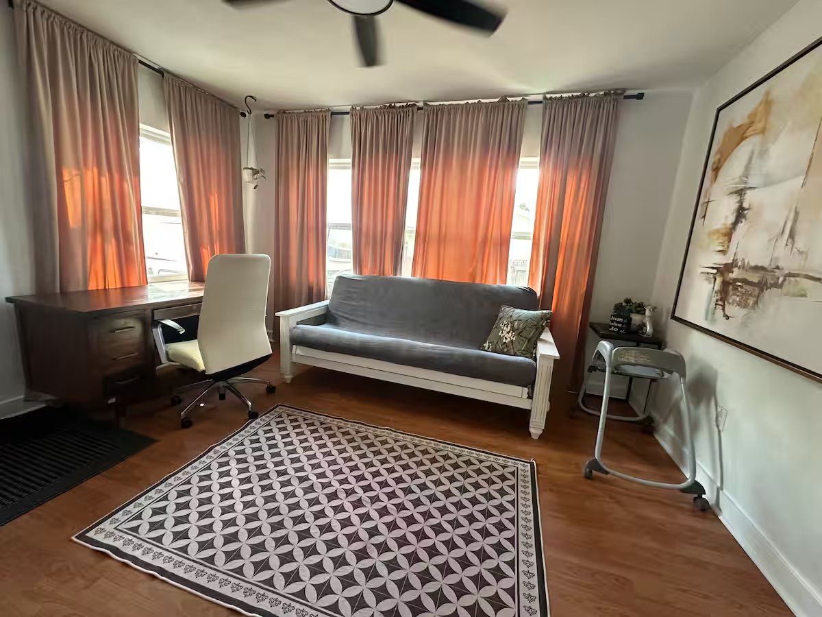 Office and bonus room with futon and desk