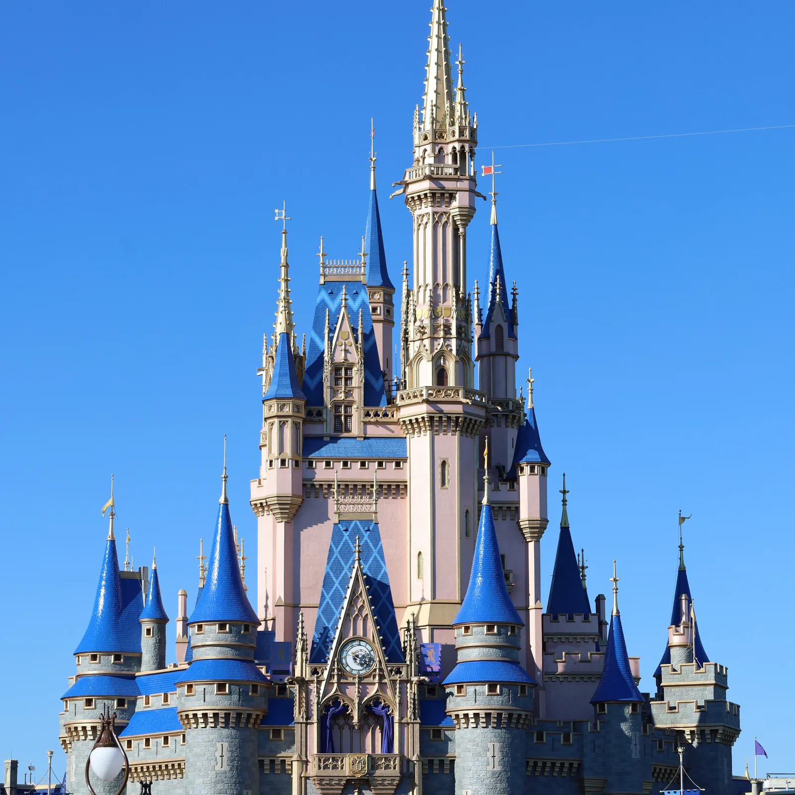 Cinderella Castle at Magic Kingdom, Walt Disney World, against a clear blue sky